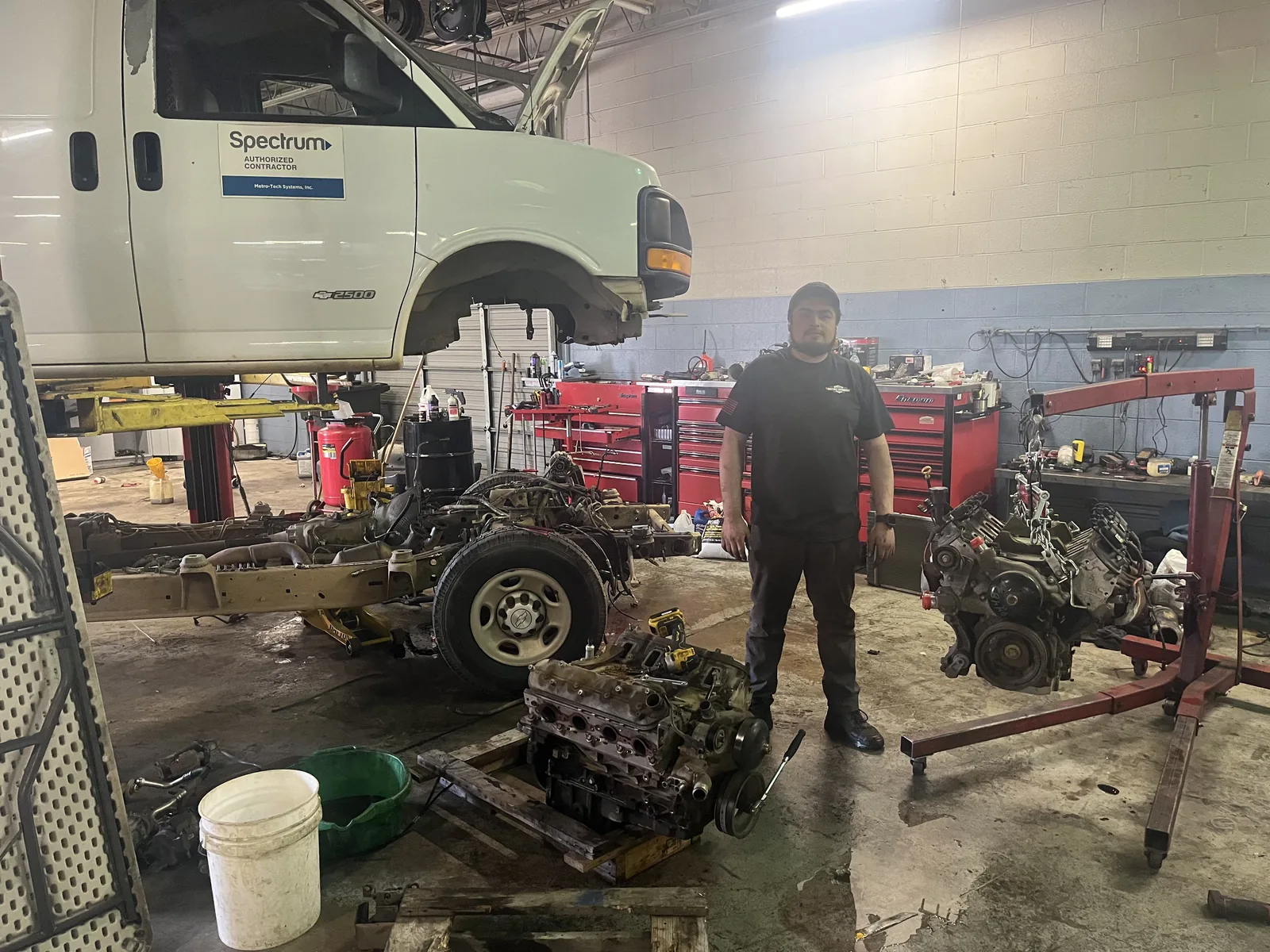 Engine swap in service bay at Mint Hill Automotive