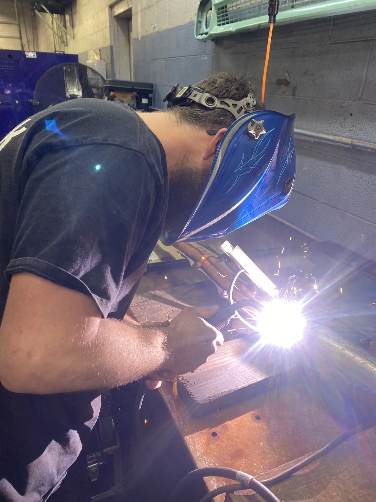 Welding repair work at Mint Hill Automotive shop